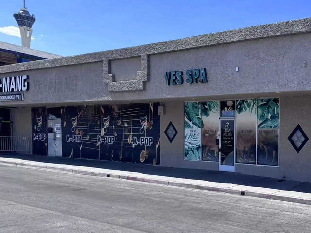 Yes SPA storefront on E Sahara Ave in Las Vegas, NV, with the STRAT tower behind the plaza