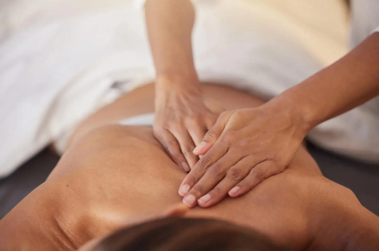 Skilled hands giving a back massage at Yes SPA Las Vegas